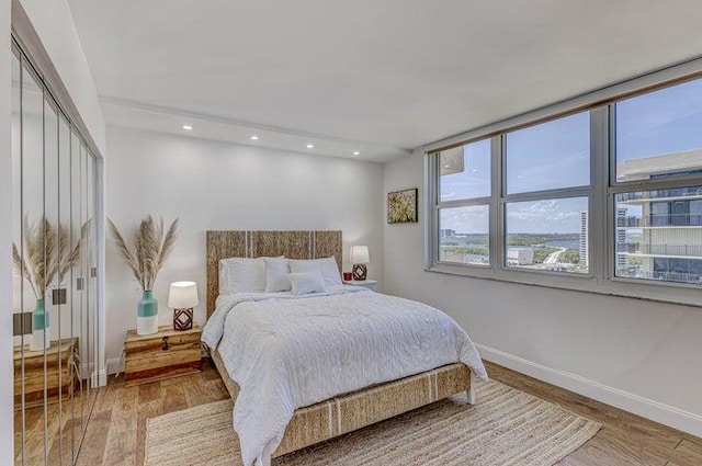 bedroom with hardwood / wood-style floors