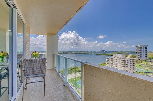 balcony featuring a water view