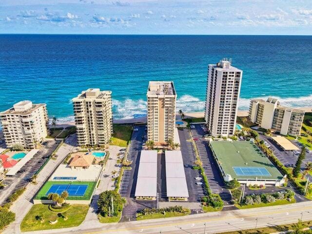 birds eye view of property featuring a water view