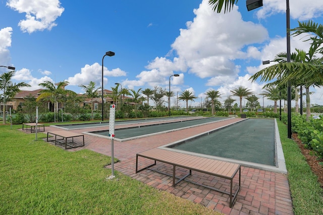 view of property's community with a yard