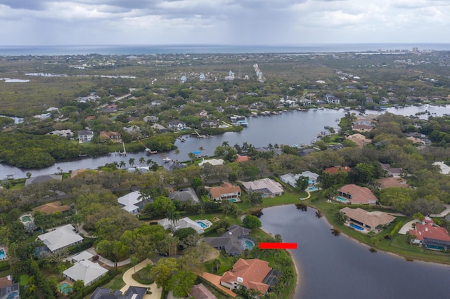 birds eye view of property featuring a residential view and a water view