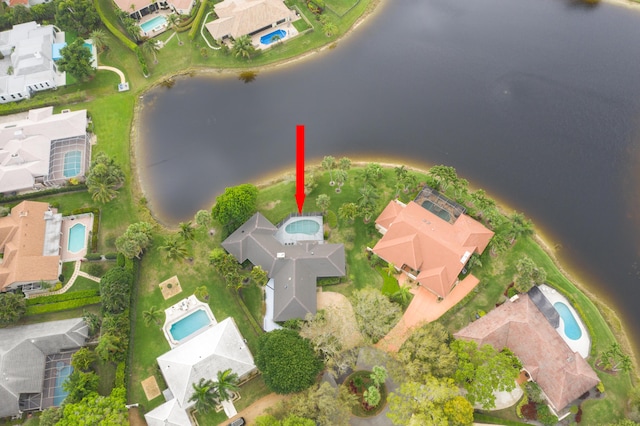 bird's eye view featuring a water view and a residential view