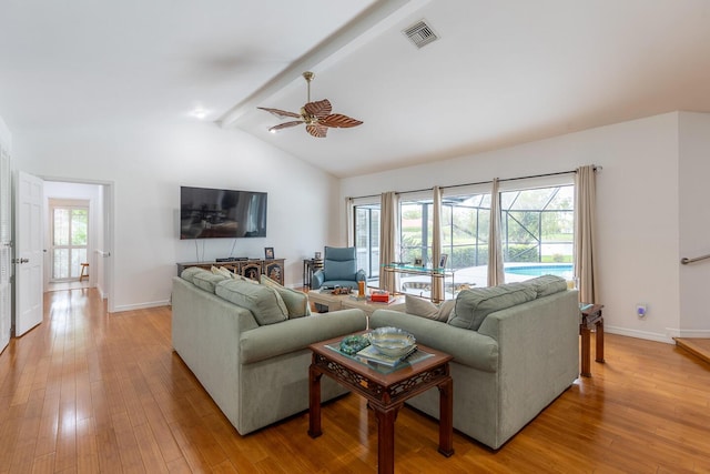 living area with light wood-style floors, plenty of natural light, and visible vents