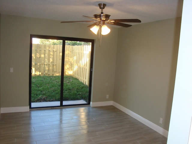 spare room with hardwood / wood-style floors