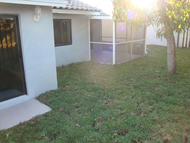 view of yard with a sunroom