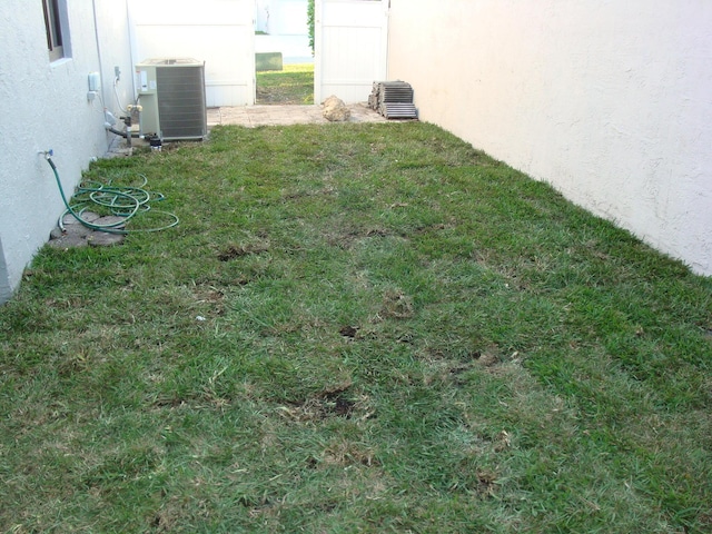 view of yard with central AC unit