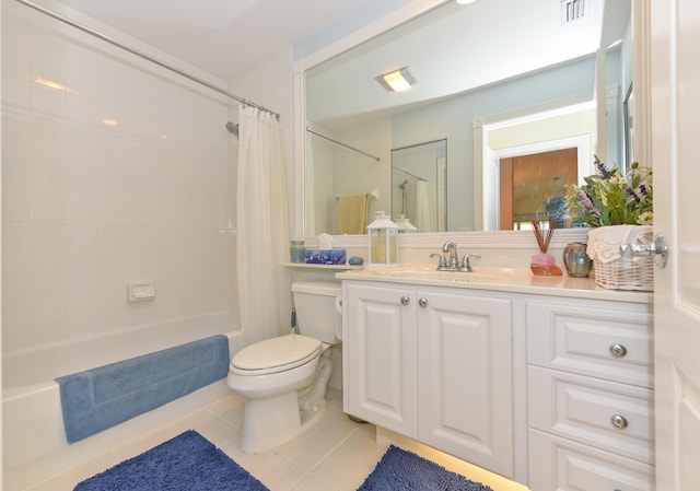 full bathroom with vanity, tile patterned floors, shower / bath combination with curtain, and toilet