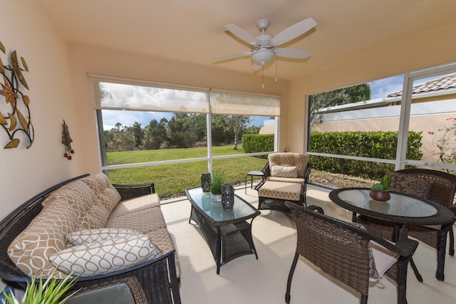 sunroom / solarium featuring ceiling fan and a wealth of natural light