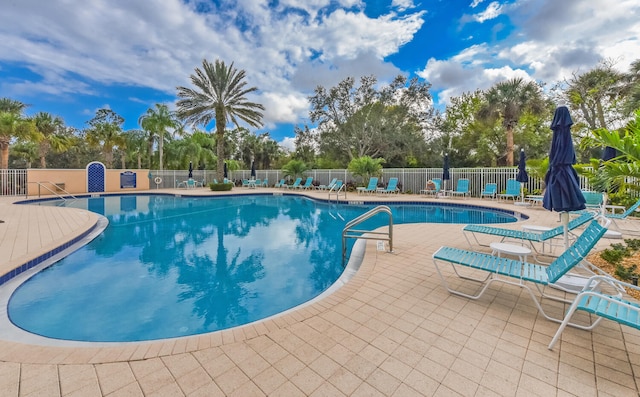 view of swimming pool with a patio area