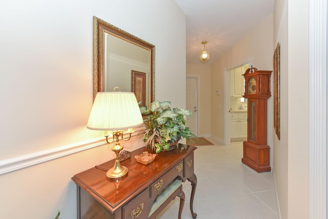 hall with light tile patterned floors