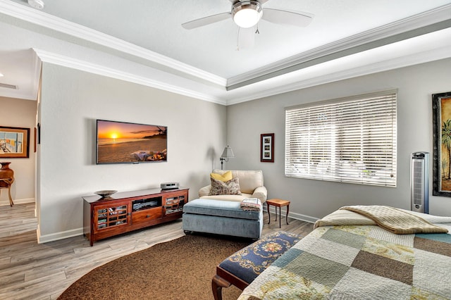 bedroom with ornamental molding, wood finished floors, a ceiling fan, and baseboards