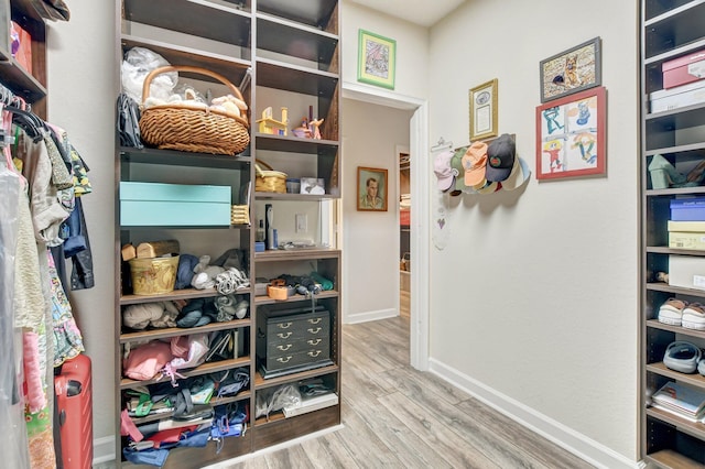 spacious closet featuring wood finished floors