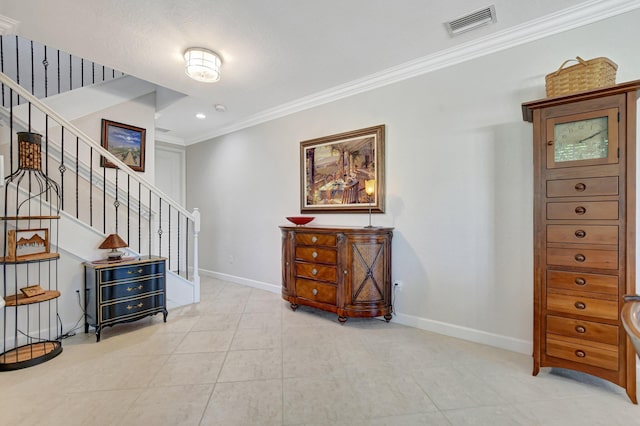 interior space with crown molding, recessed lighting, visible vents, tile patterned flooring, and baseboards