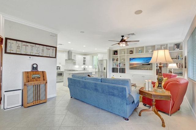 living area with light tile patterned floors, ceiling fan, recessed lighting, visible vents, and ornamental molding