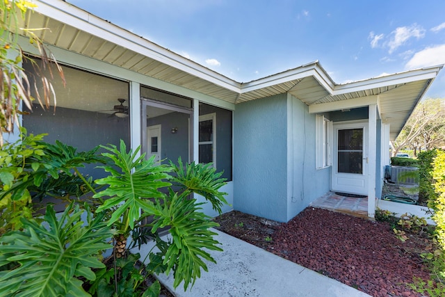 property entrance with stucco siding