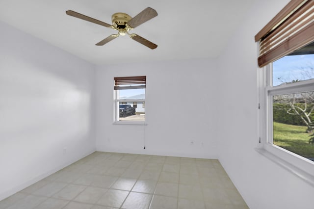 spare room featuring a ceiling fan