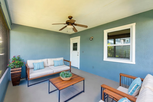 view of patio featuring a ceiling fan and an outdoor living space