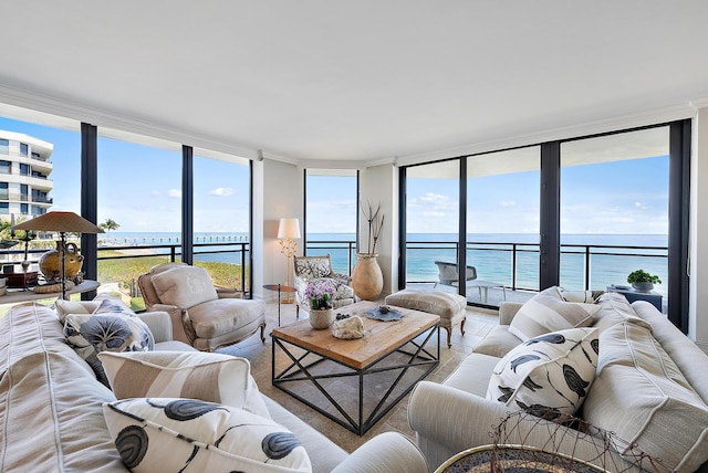 living room with expansive windows and a water view