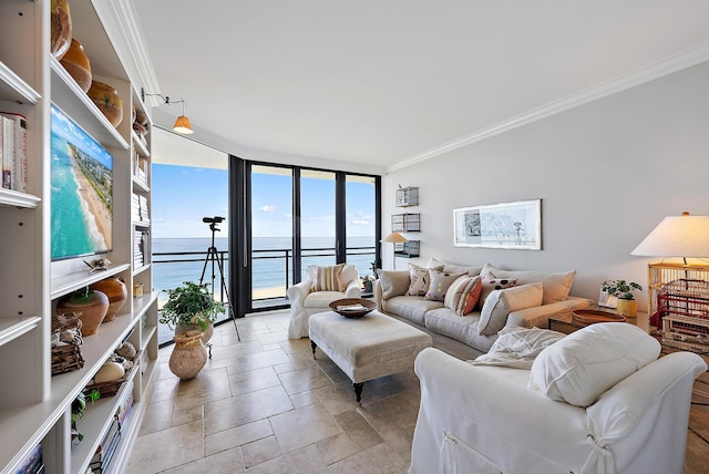 living room with a water view, ornamental molding, and floor to ceiling windows