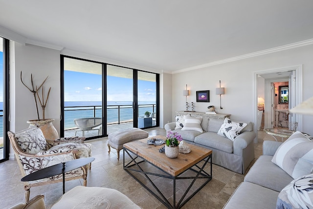 living room featuring crown molding, a water view, and a wall of windows