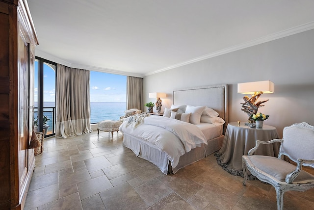 bedroom featuring expansive windows, crown molding, and a water view