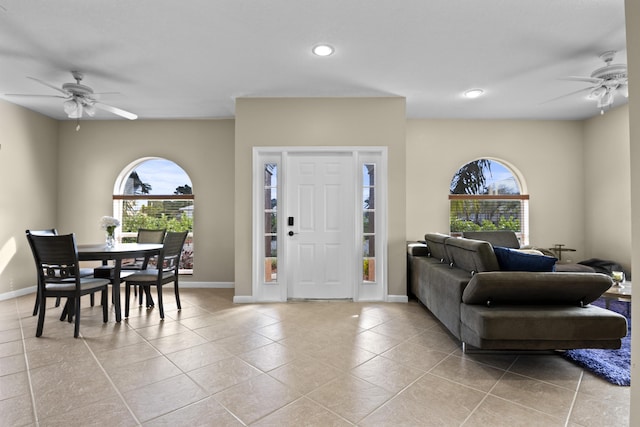 foyer with recessed lighting, light tile patterned flooring, ceiling fan, and baseboards