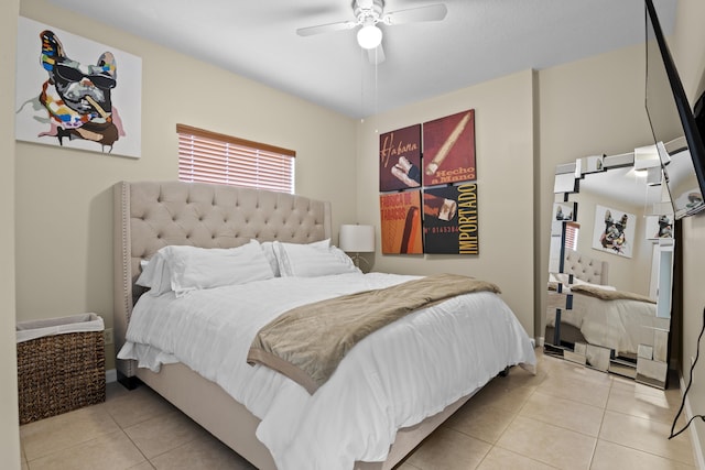 bedroom with light tile patterned floors and ceiling fan