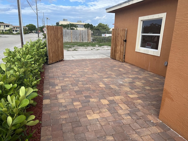 view of patio featuring fence