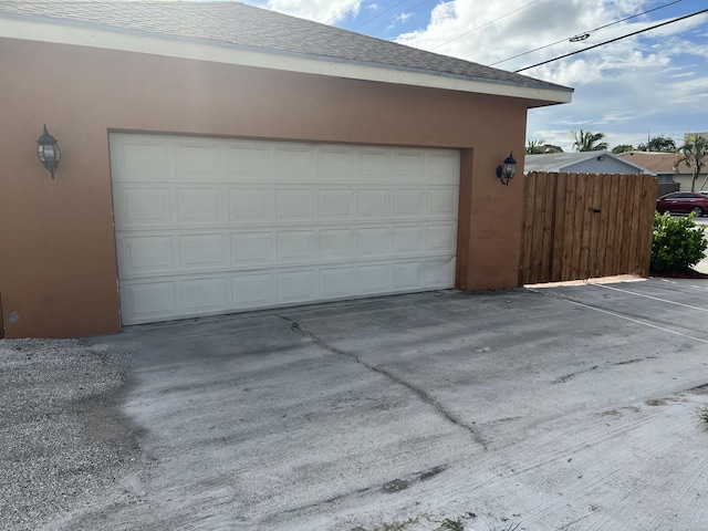 garage with fence