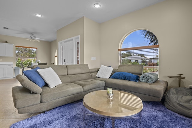 living area featuring light tile patterned floors, visible vents, recessed lighting, and a ceiling fan