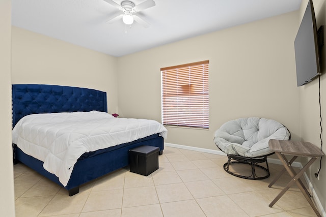 bedroom with baseboards, light tile patterned flooring, and a ceiling fan