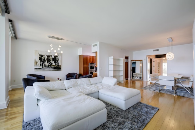 living room with light hardwood / wood-style flooring