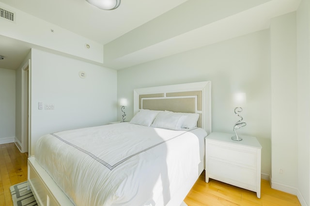 bedroom with light wood-type flooring