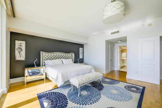 bedroom featuring wood-type flooring