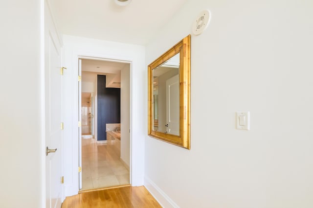 hallway featuring light hardwood / wood-style flooring