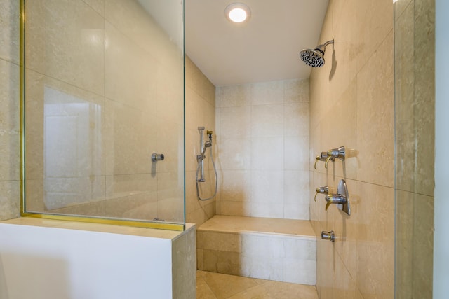 bathroom with tiled shower