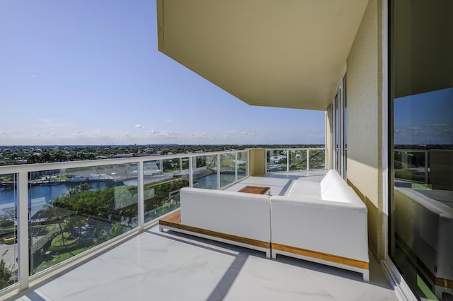 balcony featuring a water view