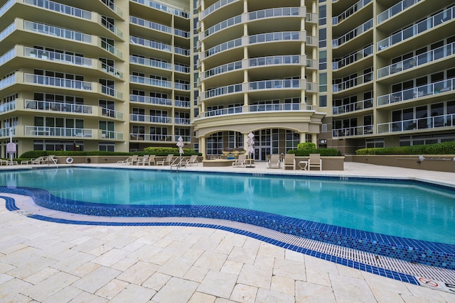 view of swimming pool with a patio