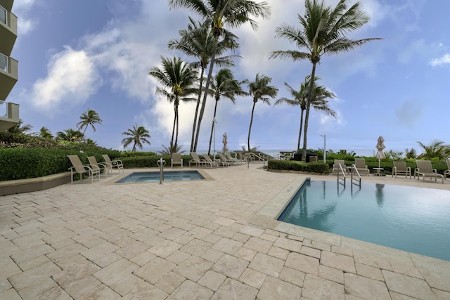 view of swimming pool with a patio area