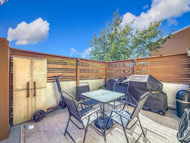 view of patio with a grill