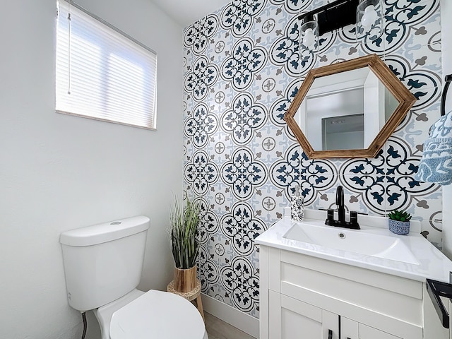 bathroom with vanity and toilet