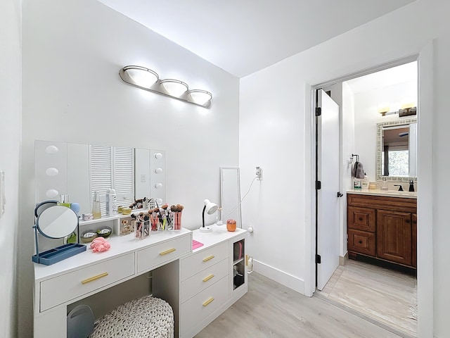 bathroom featuring vanity and hardwood / wood-style floors