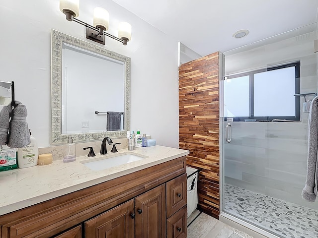 bathroom with vanity and an enclosed shower