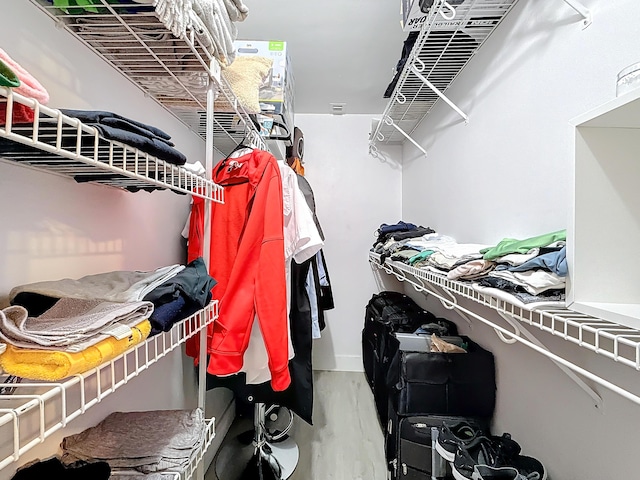 walk in closet featuring wood-type flooring