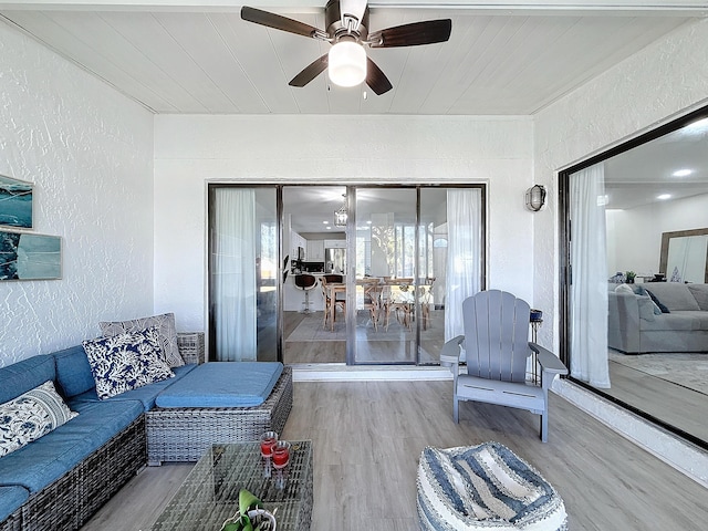 interior space with hardwood / wood-style floors and ceiling fan