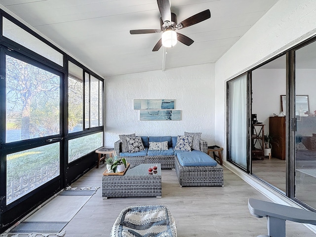 sunroom featuring ceiling fan