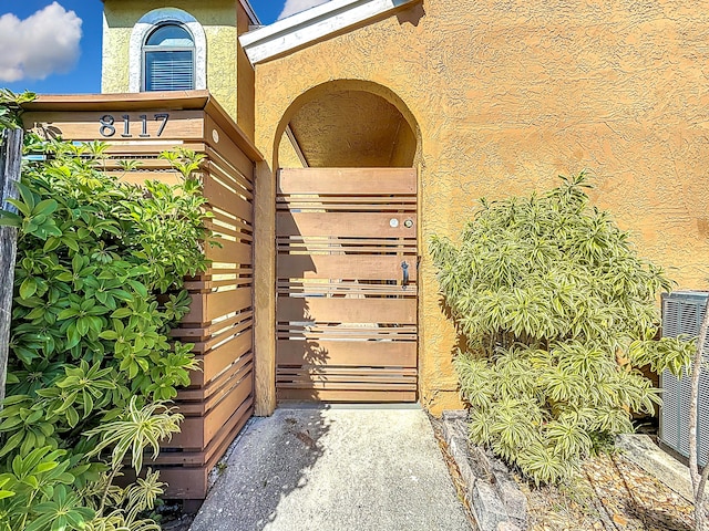 entrance to property featuring central AC