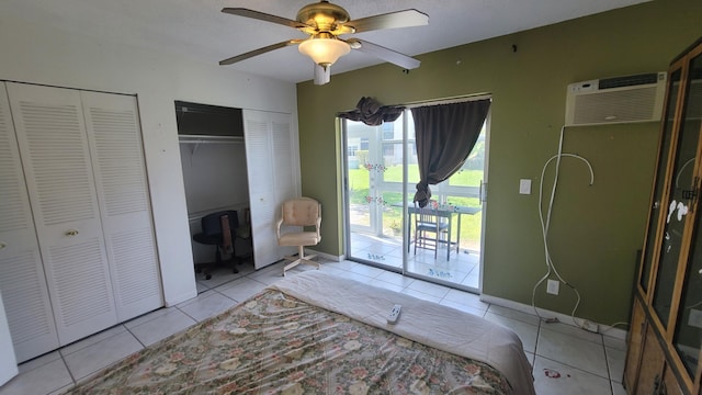 unfurnished bedroom featuring two closets, a wall mounted AC, access to outside, light tile patterned floors, and ceiling fan