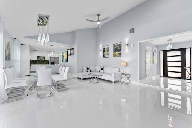 living room with lofted ceiling and ceiling fan