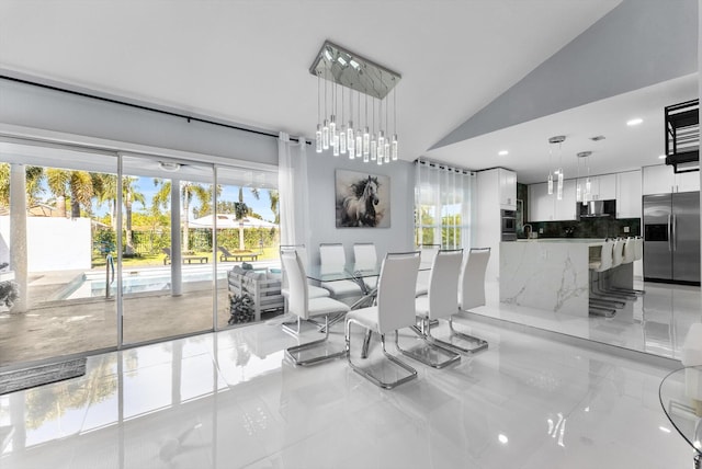 dining space featuring vaulted ceiling